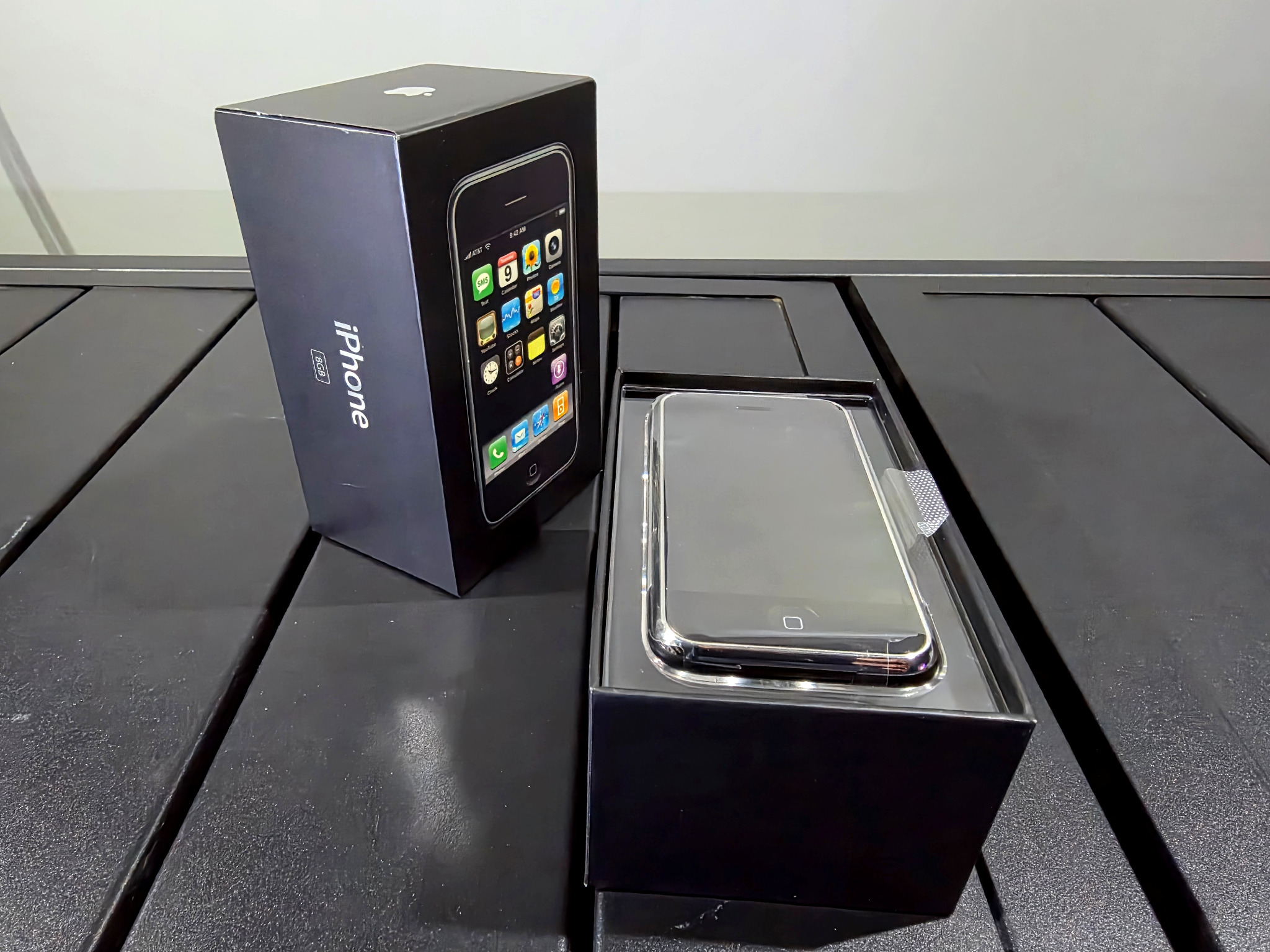 Original iPhone (2G) in box with phone visible